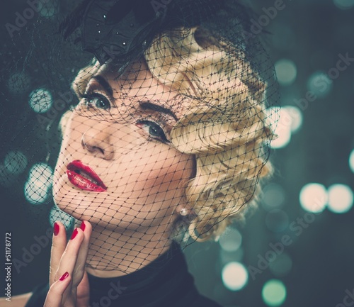 Photo: Elegant blond retro woman with red lipstick Elegant blond retro woman with red lipstick