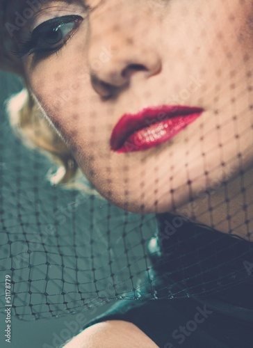 Photo: Elegant blond retro woman with red lipstick Elegant blond retro woman with red lipstick