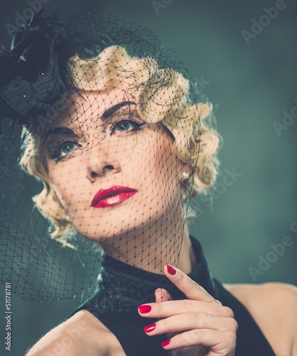 Photo: Elegant blond retro woman with red lipstick Elegant blond retro woman with red lipstick