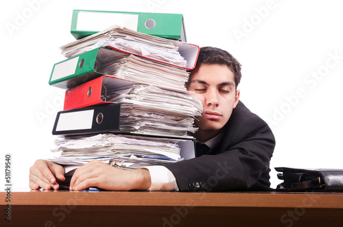 Photo: Young busy businessman at his desk Young busy businessman at his desk