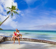 happy smiling family father and three kids on tropical beach and