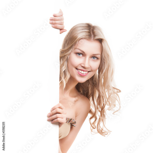 Photo: Beautiful blond smiling girl with a billboard Beautiful blond smiling girl with a billboard