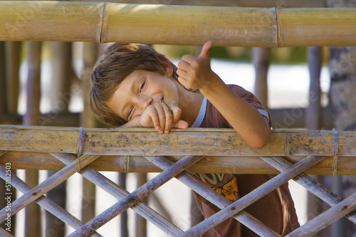 Photo: young happy smiling child boy enjoying summer outdoor portrait young happy smiling child boy enjoying summer outdoor portrait