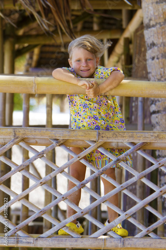 Photo: young happy smiling child girl enjoying summer outdoor portrait young happy smiling child girl enjoying summer outdoor portrait
