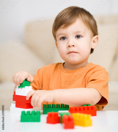 Photo: Boy is playing with building blocks Boy is playing with building blocks