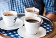Waiter serving coffee