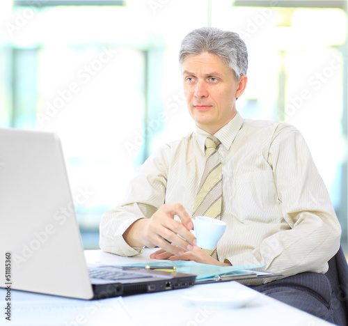 Photo: The businessman at work. The businessman at work.
