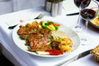 Grilled meat and baked vegetables