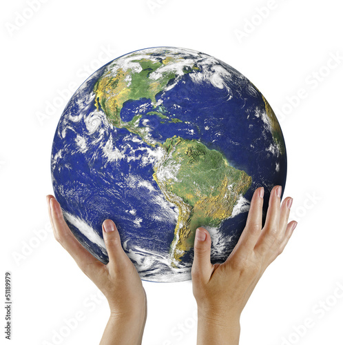 Photo: Planet earth on palms.Elements of this image furnished by NASA Planet earth on palms.Elements of this image furnished by NASA