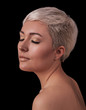 Face portrait of beautiful young woman isolated on black