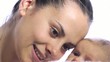 Close up of a young mother holding her baby.