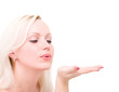 blonde woman blowing while sending an air kiss