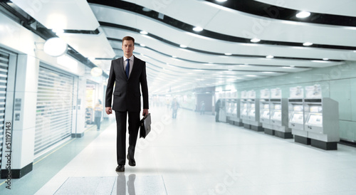 Photo: business man walking in subway business man walking in subway