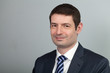 Smiling Businessman in Suit and Tie