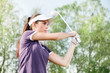 Woman playing golf