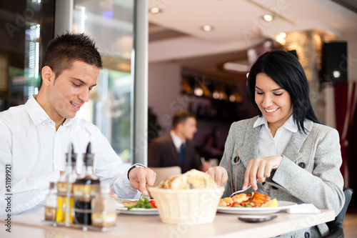 Photo: Business lunch restaurant people eating meal Business lunch restaurant people eating meal