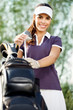 woman with golf equipment