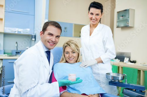 Photo: Dentist showing dental mold Dentist showing dental mold