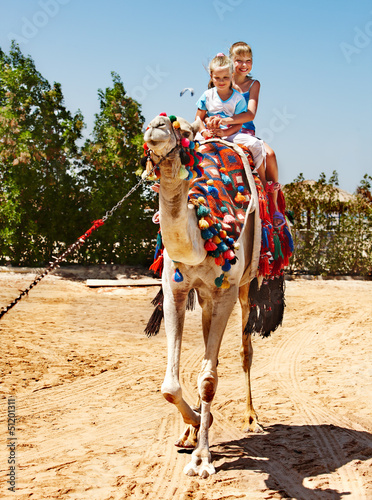 Photo: Tourists riding camel on the beach of Egypt. Tourists riding camel on the beach of Egypt.