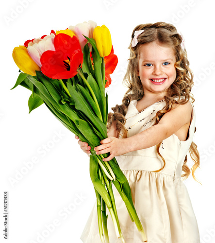 Photo: Child with spring flower. Child with spring flower.