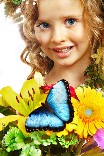 Photo: Child with butterfly and flower. Child with butterfly and flower.