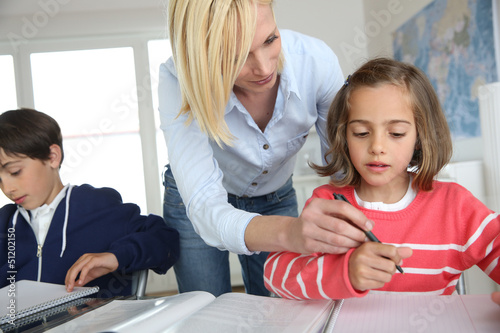 Photo: Children sitting in classroom with teacher Children sitting in classroom with teacher