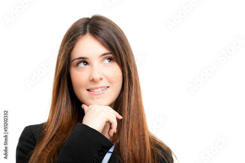 Photo: Thoughtful young woman looking up Thoughtful young woman looking up