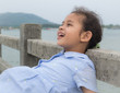A cute joyful girl on the bridge