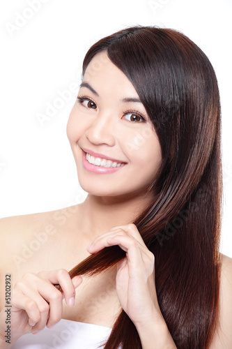 Photo: young woman happy touch her hair young woman happy touch her hair