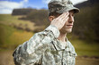 Male army soldier in the uniform saluting