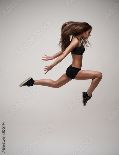 Photo: beautiful modern dancer jumping beautiful modern dancer jumping
