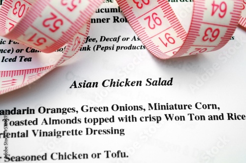 Photo: Menu and measure tape concept Menu and measure tape concept