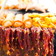 Foto: Traditional Thai food at market. Dry beef meat, spring rolls Traditional Thai food at market. Dry beef meat, spring rolls