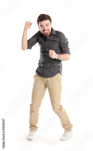 Photo: Excited handsome man with arms raised in success Excited handsome man with arms raised in success