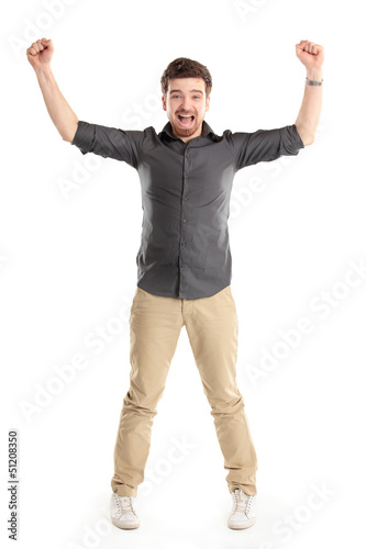 Photo: Excited handsome man with arms raised in success Excited handsome man with arms raised in success