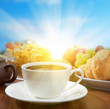 sunny breakfast with coffee and fruits
