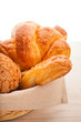 Photo: basket of pastries with muffins, croissants basket of pastries with muffins, croissants
