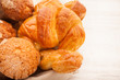 Photo: basket of pastries with muffins, croissants basket of pastries with muffins, croissants
