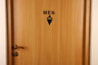 Toilet sign on wooden door