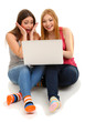Two girl friends with with laptop isolated on white