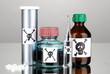 Deadly poison in bottles on grey background