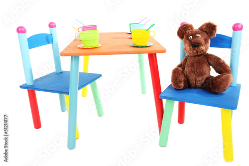 Photo: Small and colorful table and chairs for little kids isolated Small and colorful table and chairs for little kids isolated
