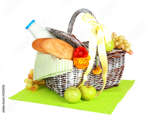 Photo: Picnic basket with fruits and bottle of milk, isolated on white Picnic basket with fruits and bottle of milk, isolated on white