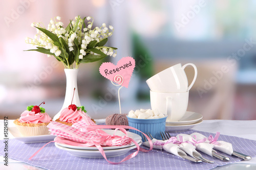 Photo: Tableware for tea drinking on bright background Tableware for tea drinking on bright background