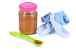 Baby food with baby supplies isolated on white