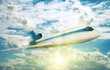 passenger plane flying in the sunny sky