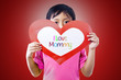 Boy give love card to mom