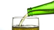 Beer is pouring into glass on white background