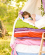the girl lies on a bed. the fairy tale "the princess on a pea"