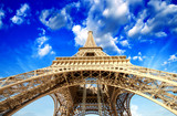 Paris. Powerful structure of Magnificent Eiffel Tower at sunset